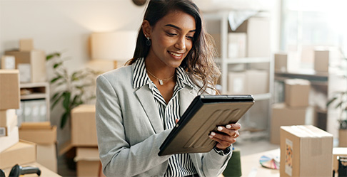 A pile of goldrushdispatch Ground Advantage packages ready to be shipped.